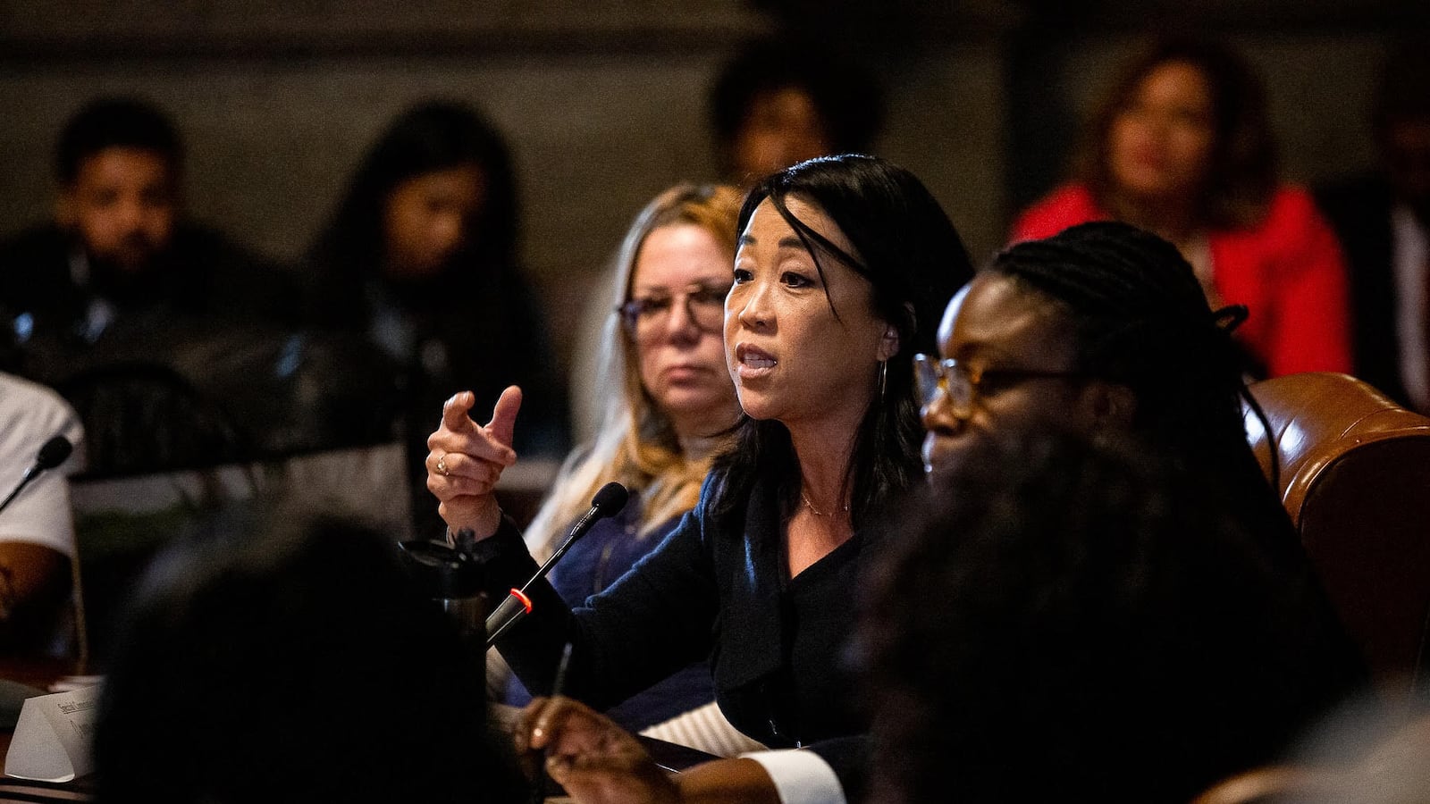 A City Council member speaks during a meeting.