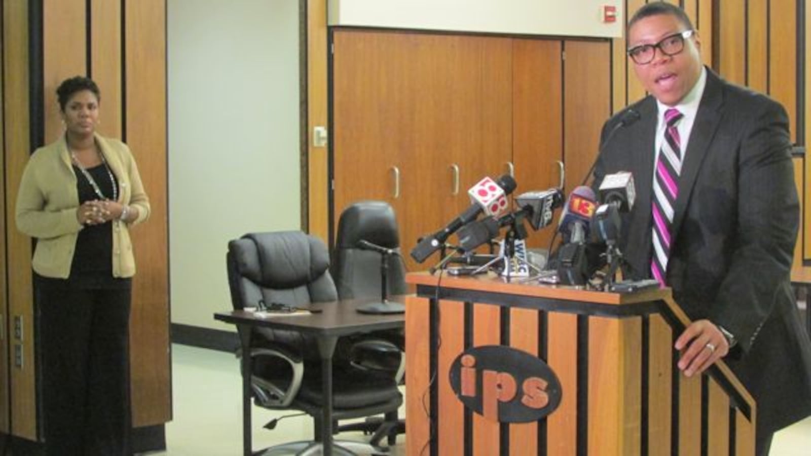 Le Boler, organizational strategist at IPS, looked on as Superintendent Lewis Ferebee spoke to the press last March about the district’s financial situation.