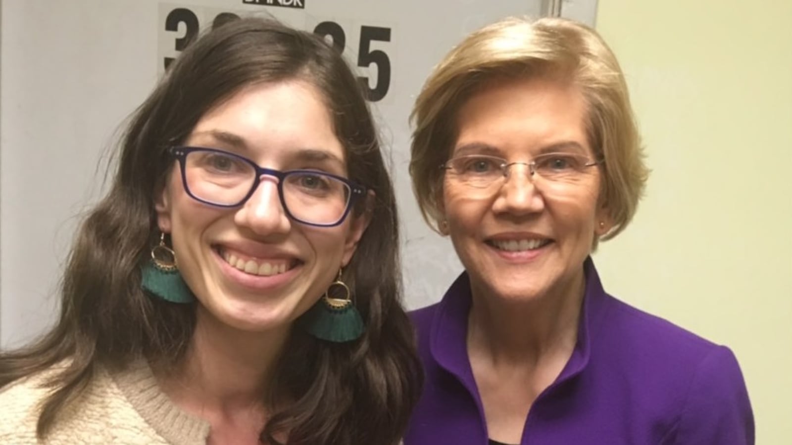 Liat Olenick, left, with Democratic presidential candidate Elizabeth Warren in March. Olenick's advocacy resulted in Warren committing publicly to select a public school educator as U.S. education secretary if elected.