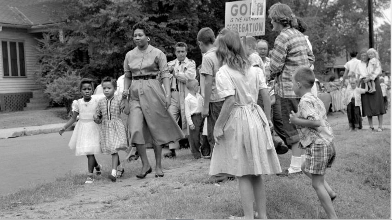 Grace McKinley escorts her daughter Linda Gail and a friend to Fehr Elementary School in Nashville in September 1957 amid Nashvillians protesting desegregation of the city's schools.