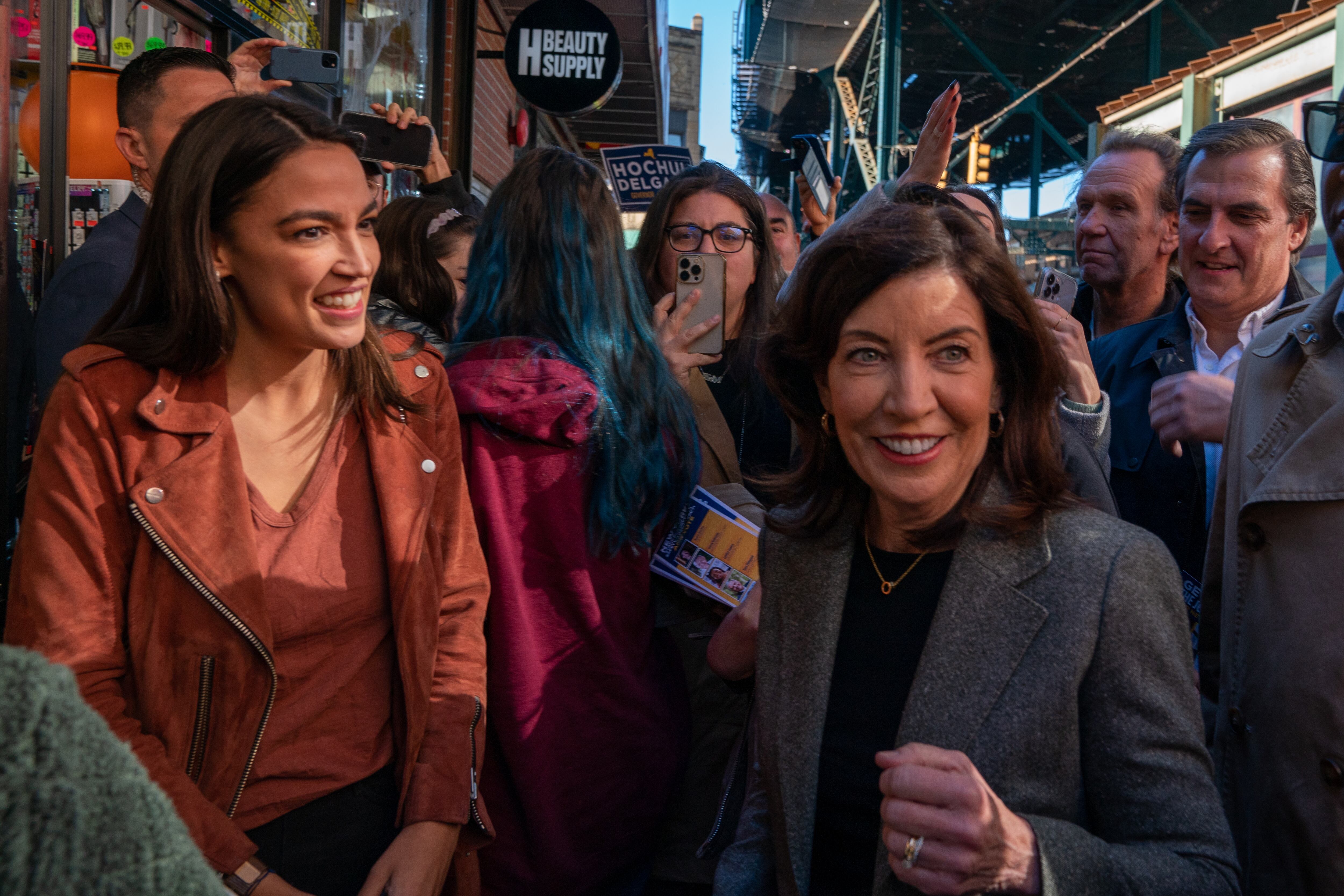 Two women stand in the front of a small crowd