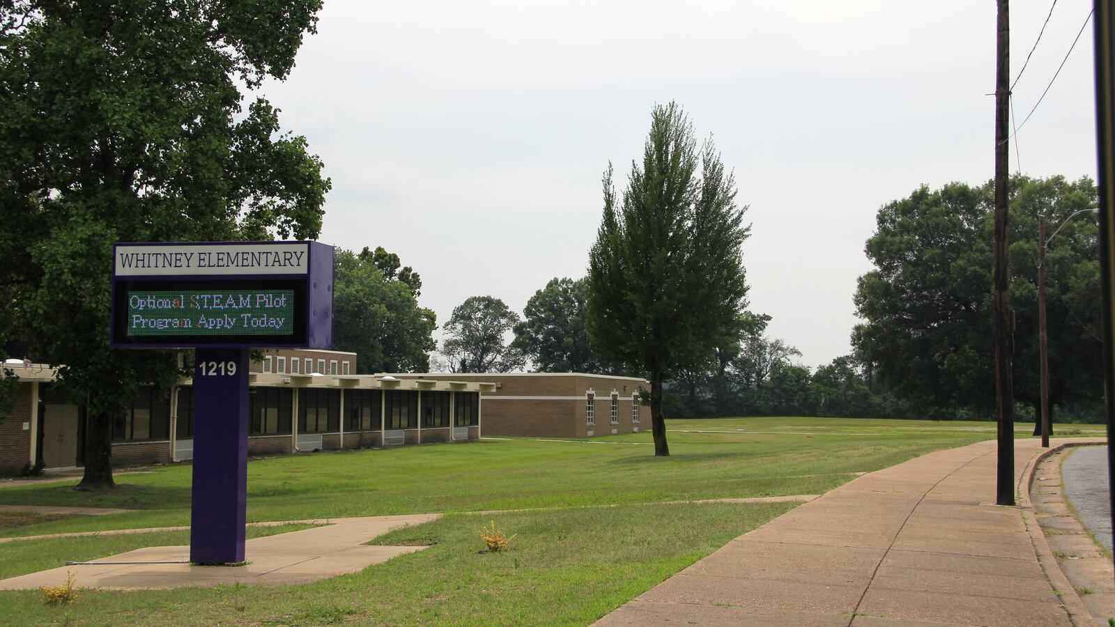 Whitney Achievement Elementary School, in the Memphis community of Frayser, is located adjacent to a field (behind the tree line) that is the site of a proposed demolition landfill.
