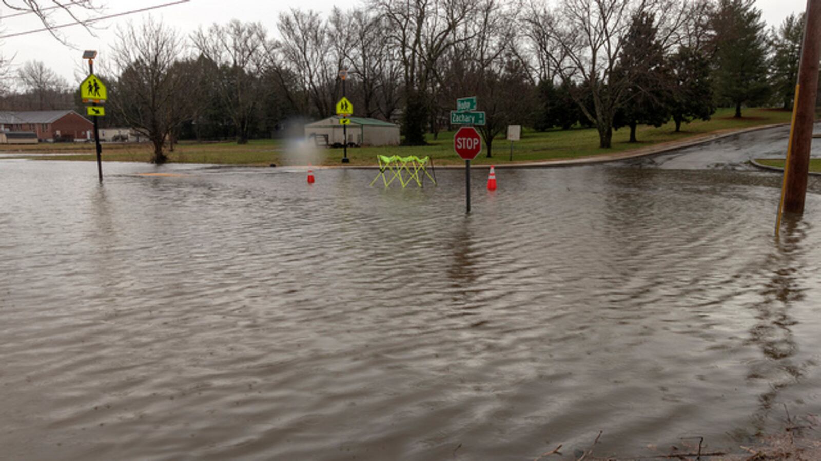 Flash floods caused by heavy rains shutter streets in Overton County, home to one of many Tennessee districts that have closed schools in February due to flooding or illness.