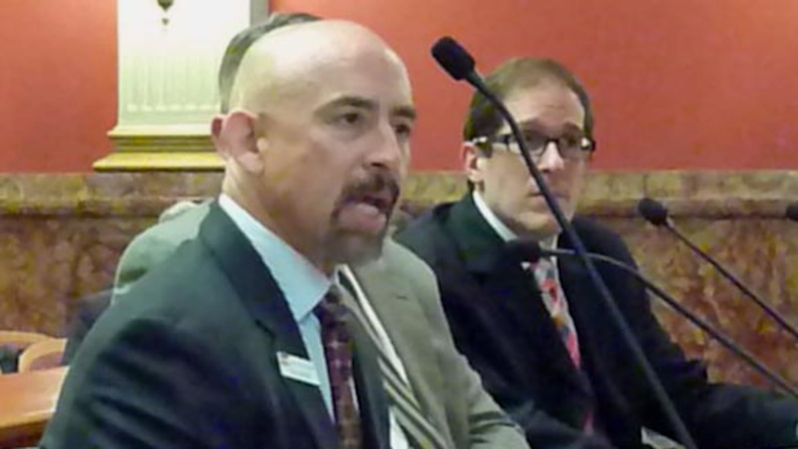 Lt. Gov. Joe Garcia makes points on higher education bill as sponsor Mark, Ferrandino, speaker of the House at right, listens.