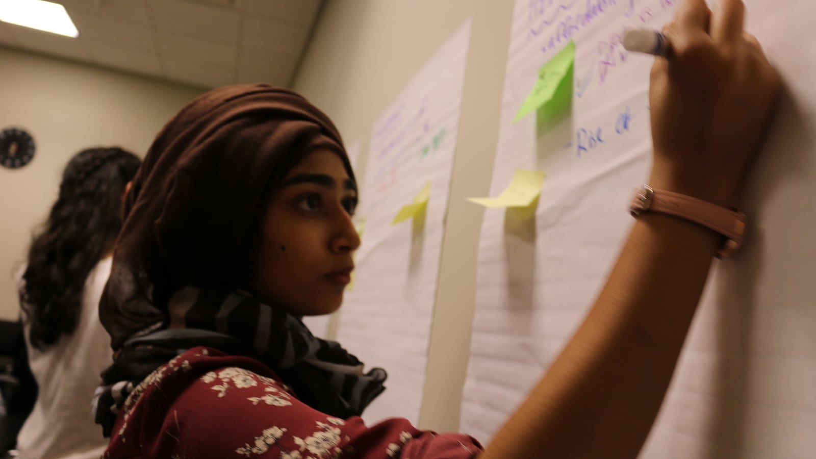 Nuzhat Wahid contributes to a brainstorming session during a recent YVote meeting.