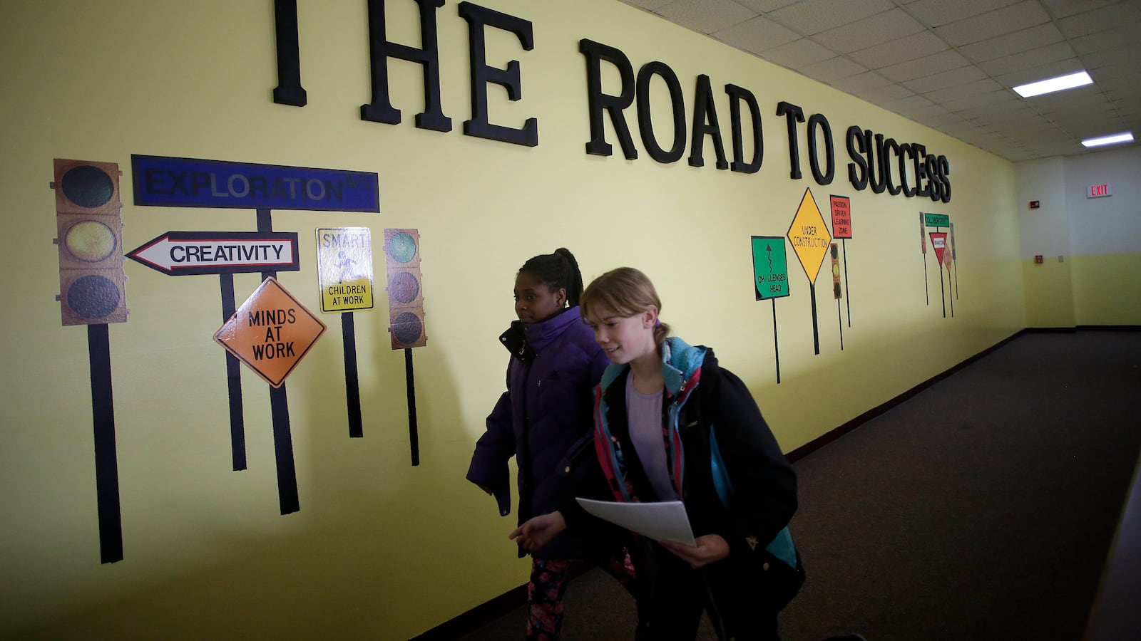 Ft. Wayne, IN: Students walk past "The Road to Success" sign displayed in the hallway at Horizon Christian Academy in Ft. Wayne, Indiana December 20, 2016. Horizon Christian Academy is one of more than 300 schools that accepts vouchers in Indiana, which has the largest statewide voucher program in the nation.