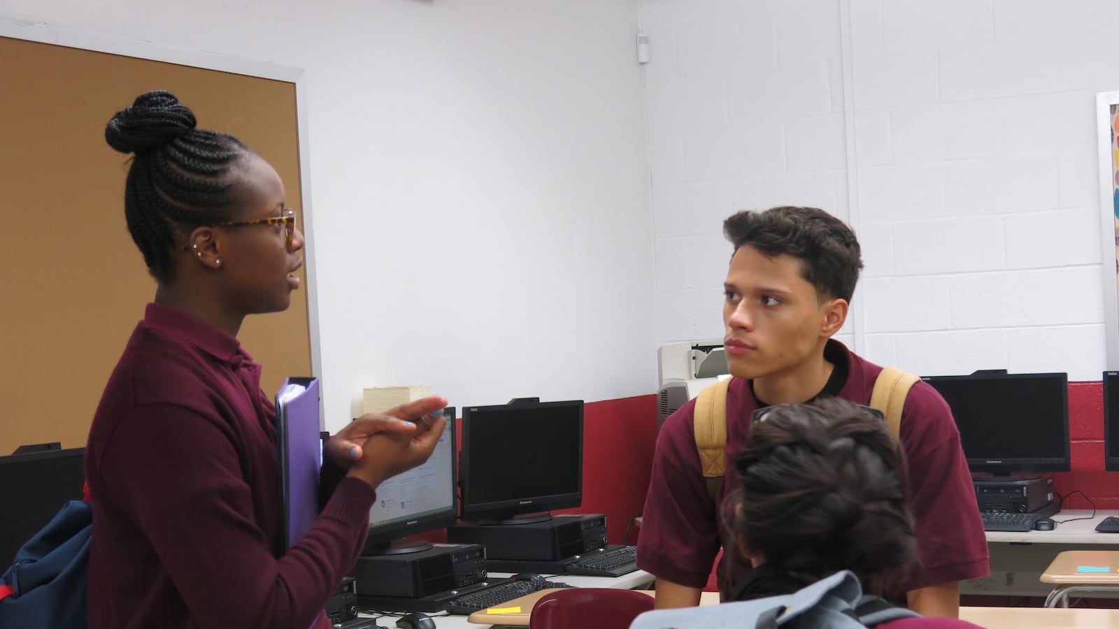 Students stay after class to talk about school segregation.