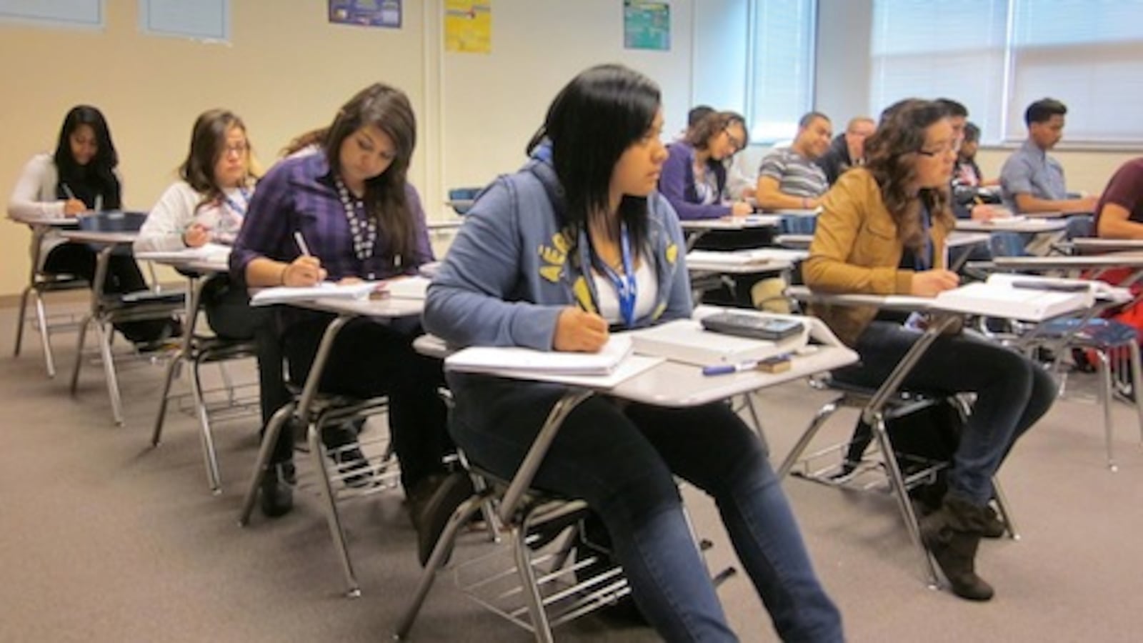 Students work on algebra problems in a college-level course at Hinkley High School in Aurora.