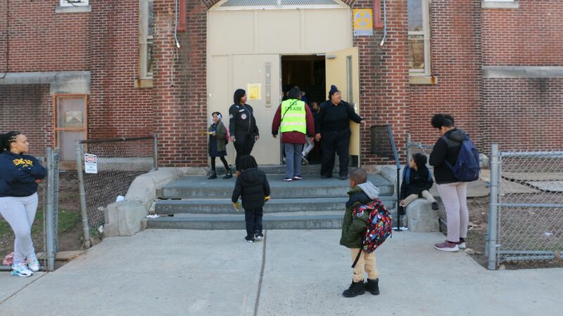 Students, caregivers, and school staff outside of Hawthorne Avenue Elementary school.