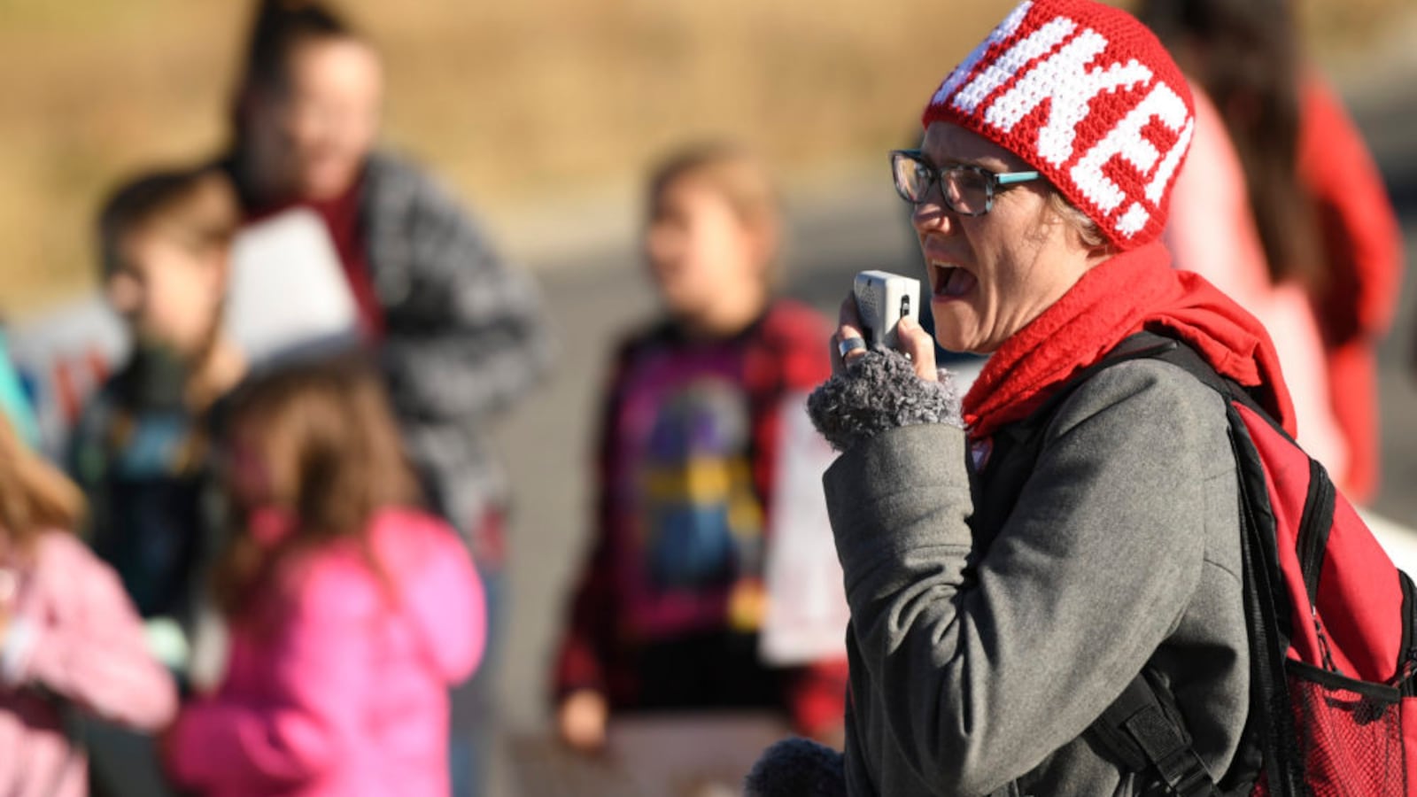 Kiersten Macreery, a third grade teacher for Park County School District, leads a chant on the first day of a teacher strike in Fairplay.