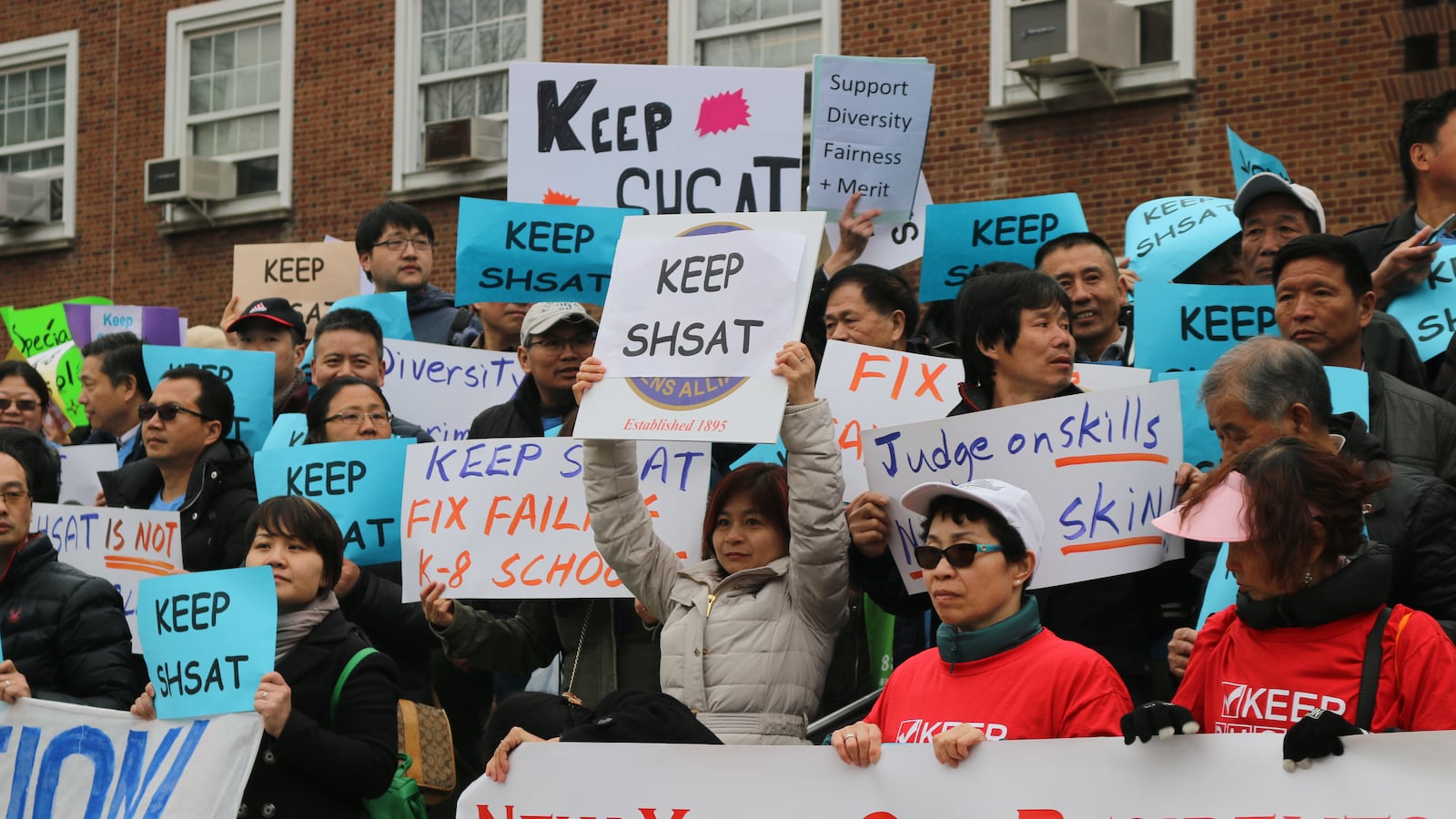 Advocates rallied ahead of a public forum at Queens Borough Hall to discuss segregation at the city's elite specialized high schools.