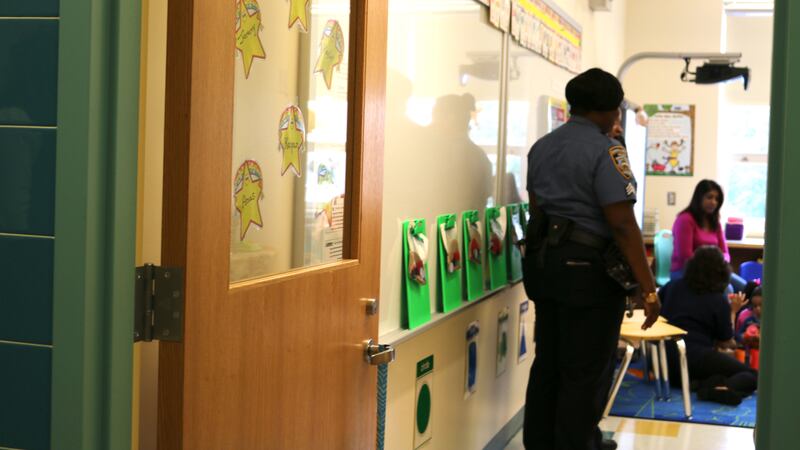 A member of the New York Police Department visits a classroom at Queens Explorers Elementary School.