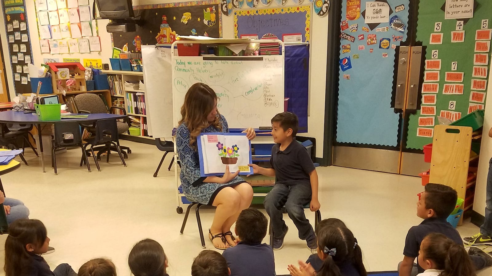 Bilingual teacher Lourdes Sierra reads with her kindergarten students at Vado Elementary School in New Mexico.