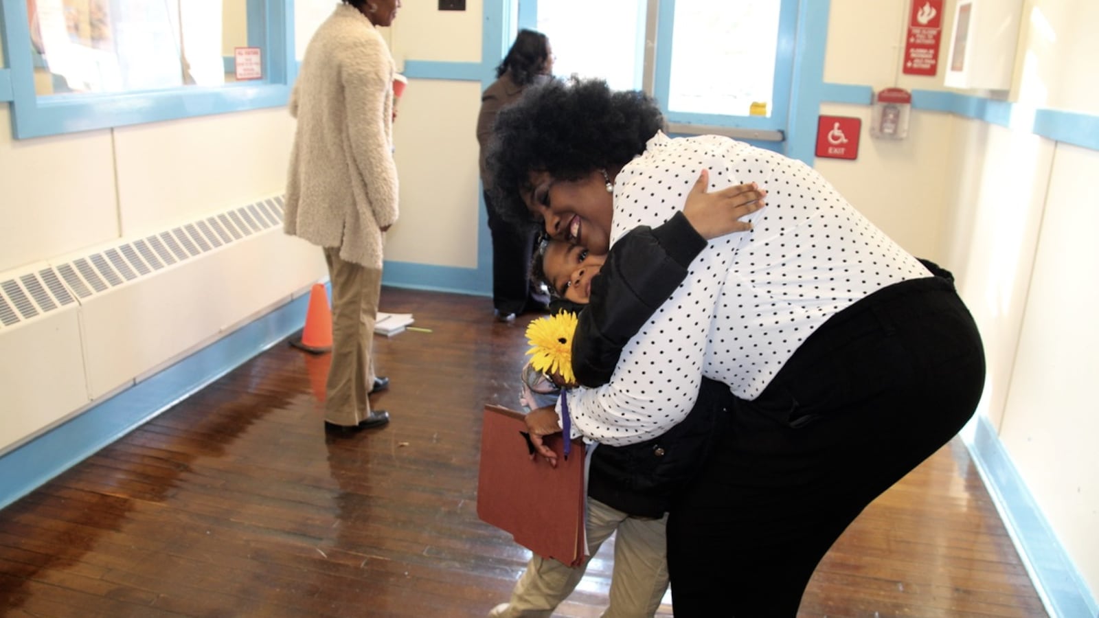 Stephenie Washington greets dozen of students at Georgian Hills Achievement Elementary School Monday morning.