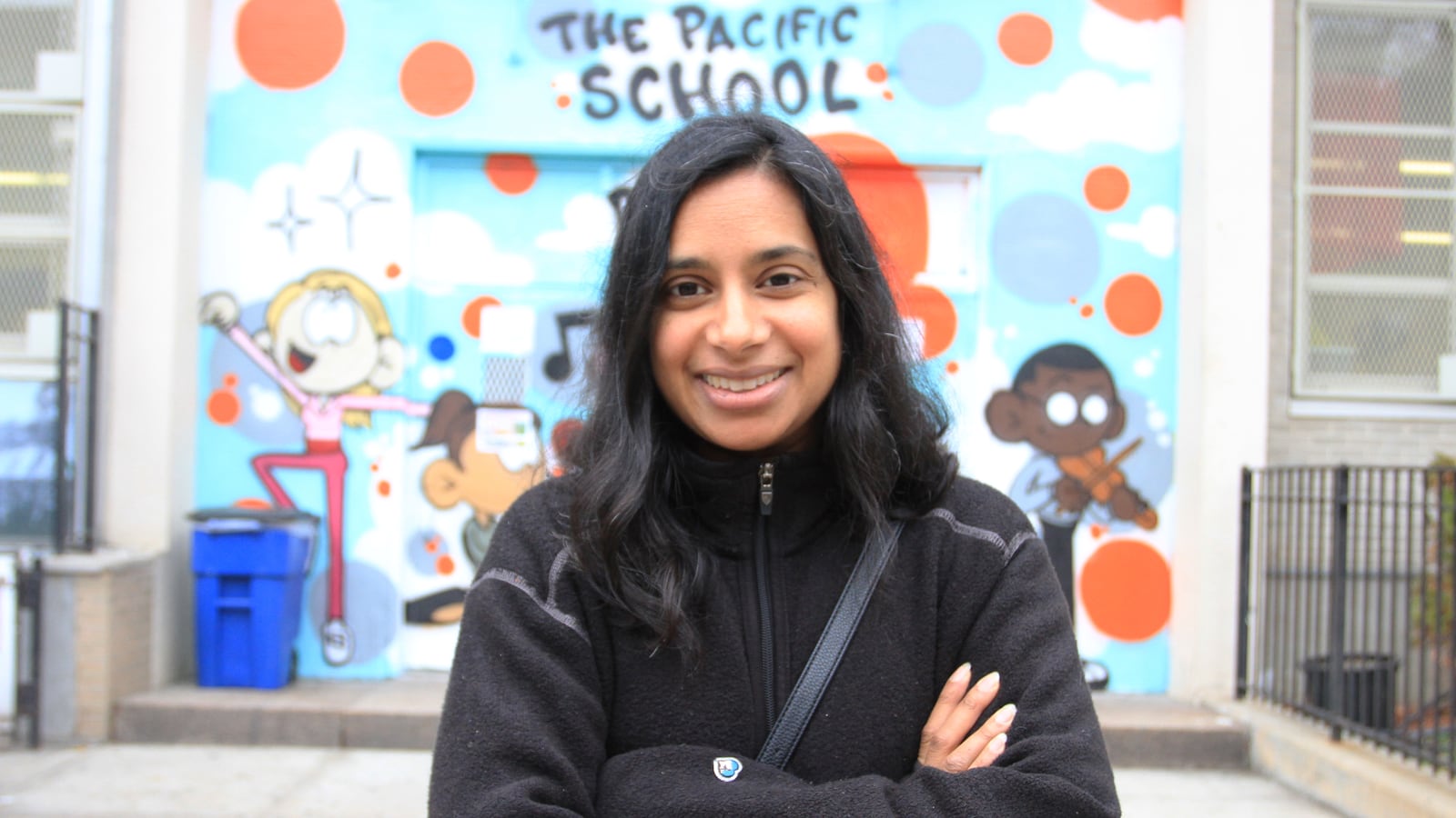 Mishi Faruqee stands outside her daughter's school, P.S. 38 The Pacific School in Boerum Hill, Brooklyn.