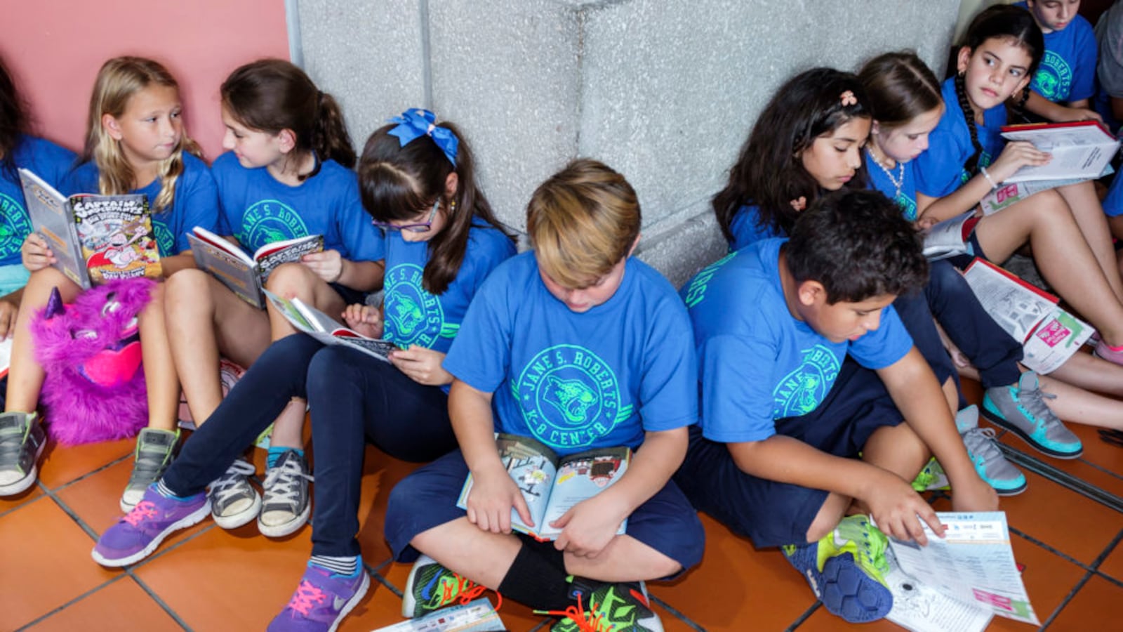 Students reading at the Book Fair International at Miami Dade College Wolfson Campus. (Photo by: Jeffrey Greenberg/UIG via Getty Images)