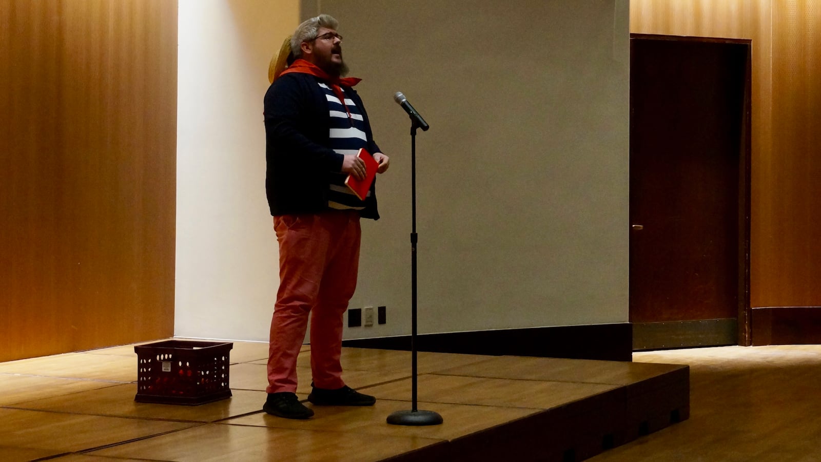 Derek Gould, a teacher at Paramount Brookside, talked about his second job as a singing gondolier at a story slam on teacher pay.