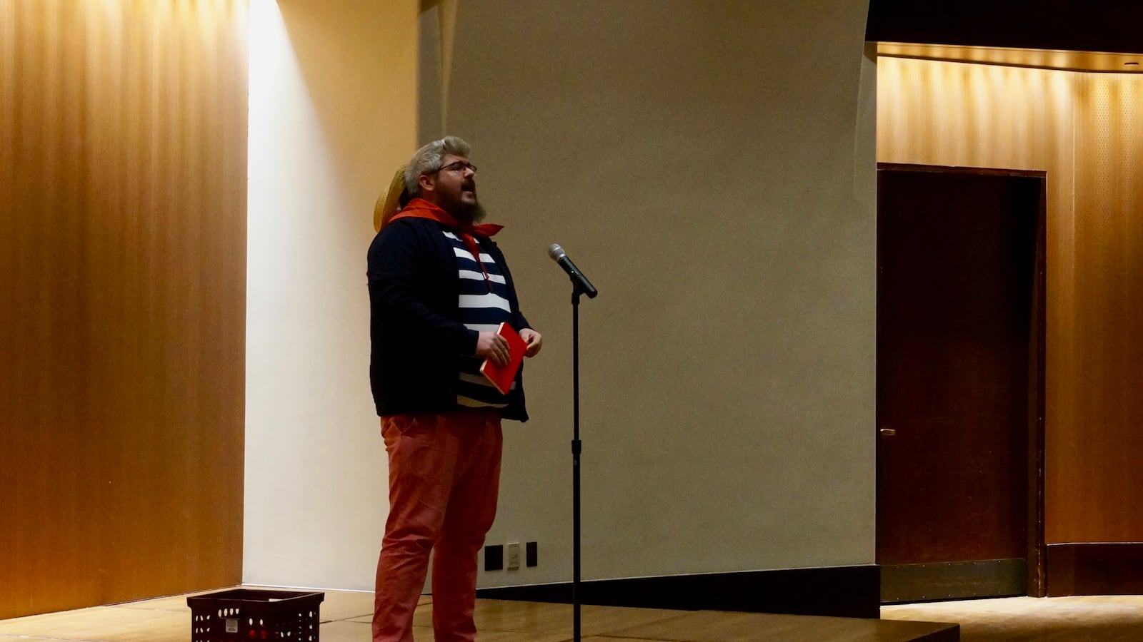 Derek Gould, a teacher at Paramount Brookside, talked about his second job as a singing gondolier at a story slam on teacher pay.