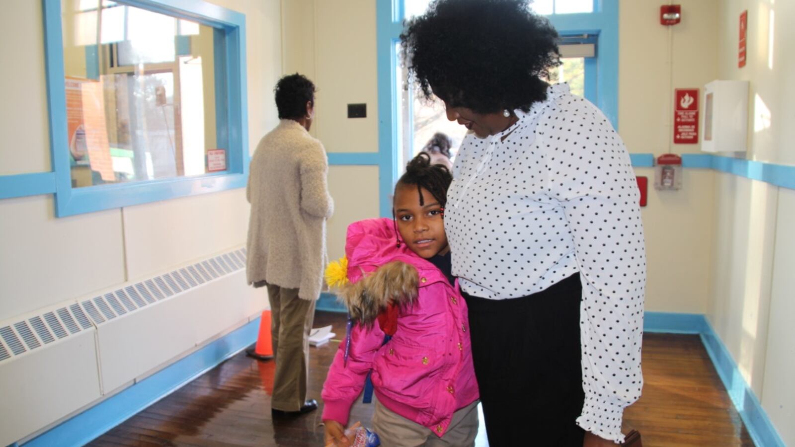 A student greets a staff member at Georgian Hills Achievement Elementary School, one of three schools that could return to local control in 2020.