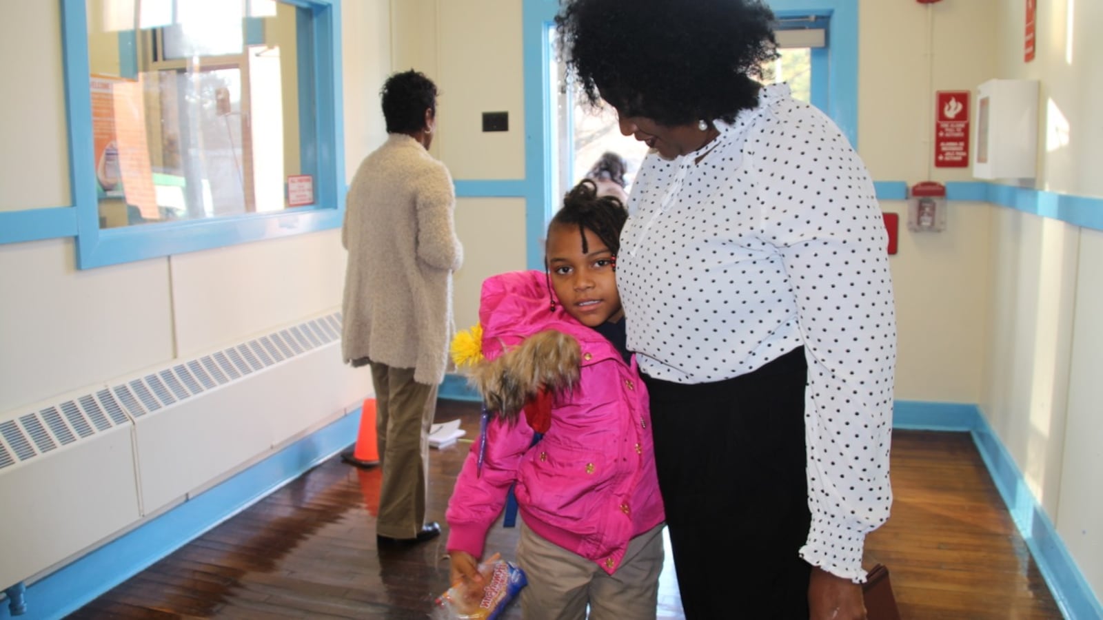 A student greets a staff member at Georgian Hills Achievement Elementary School, one of three schools that could return to local control in 2020.