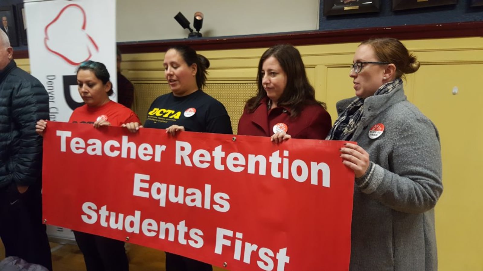 Members of the Denver Classroom Teachers Association announce the results of their strike vote Tuesday.