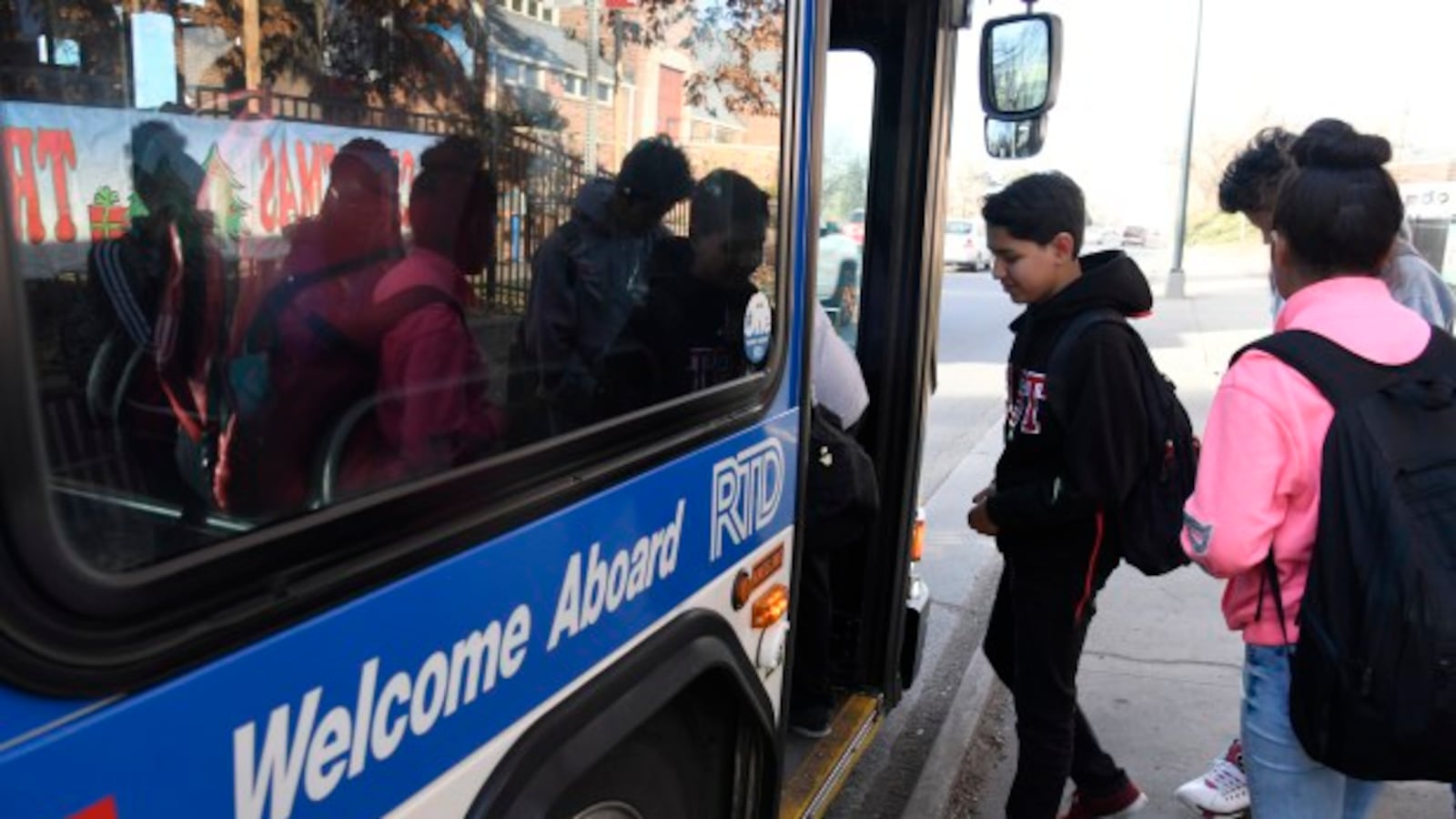 High schoolers in Denver take public buses to school.