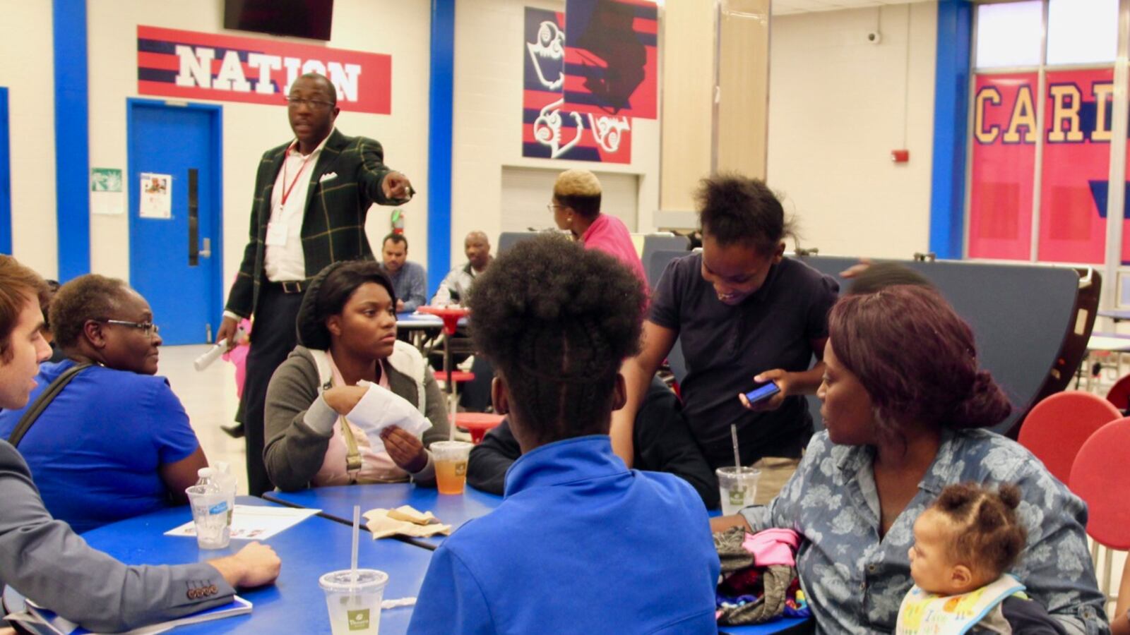 Families weigh in during a conversation on school turnaround at Wooddale High School. It was one of several stops state officials made during a listening tour on the future of improving the state’s lowest-performing schools.