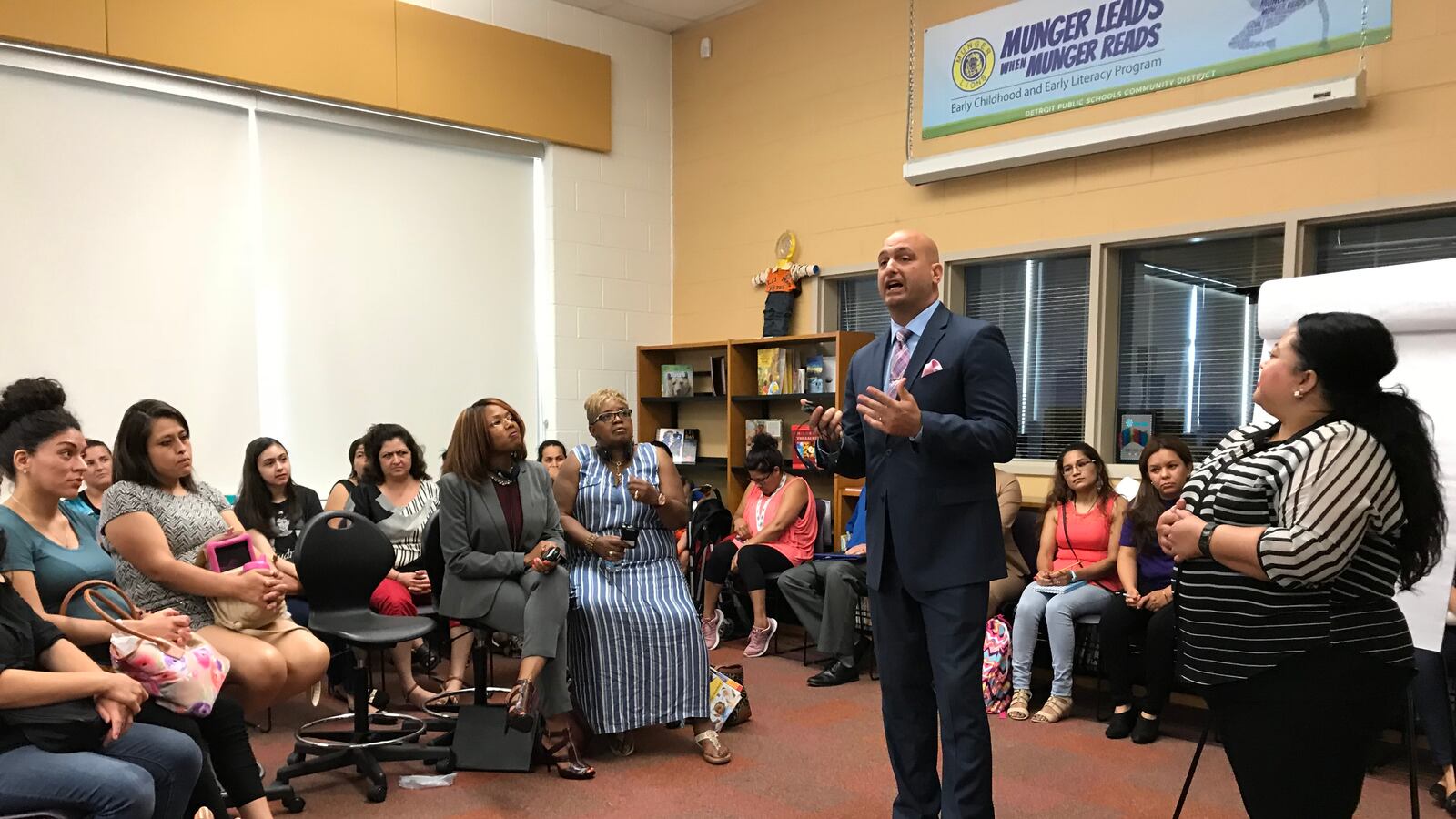 Detroit schools superintendent Nikolai Vitti addresses Spanish-speaking parents during a forum at Munger Elementary-Middle School.
