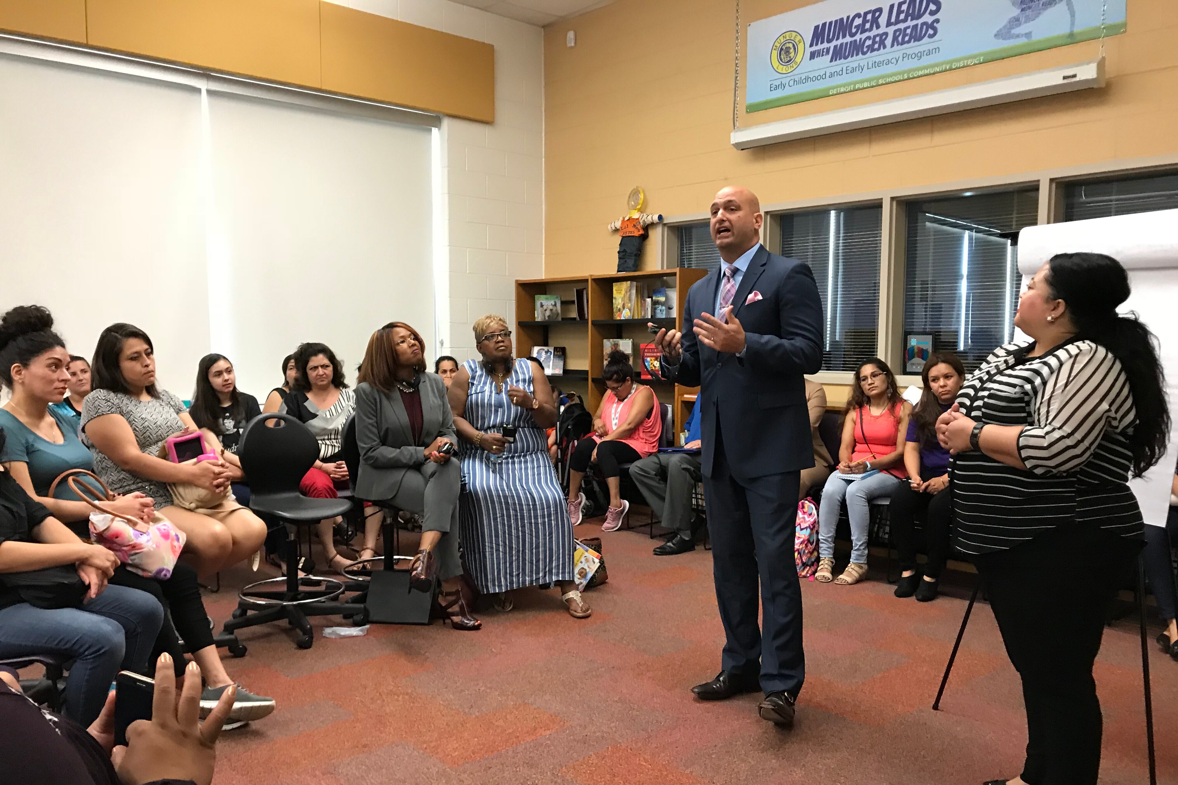 Detroit schools superintendent Nikolai Vitti addresses Spanish-speaking parents during a forum at Munger Elementary-Middle School.