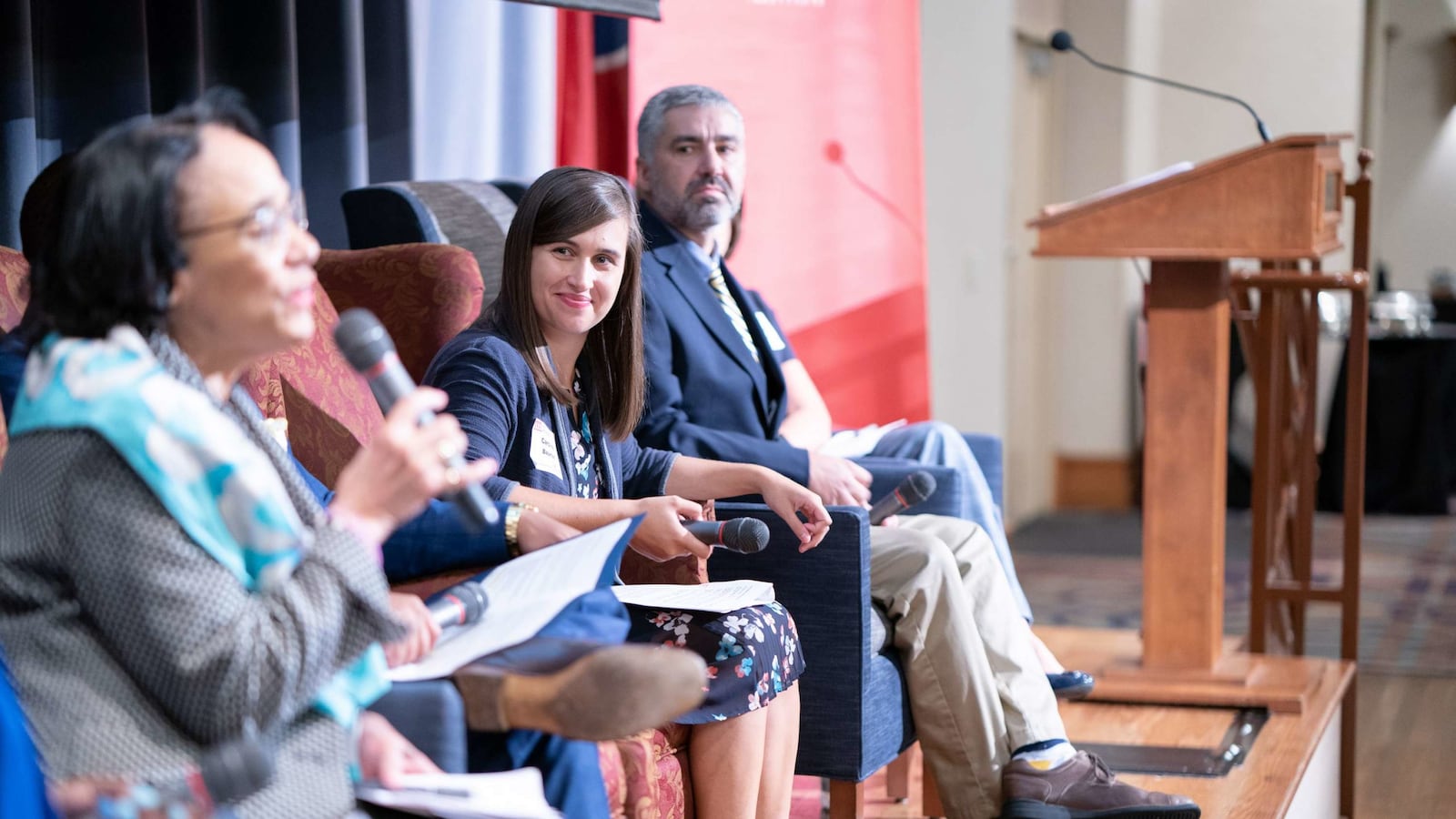 Caroline Bauman (center) moderates a panel in 2019 on teacher diversity and talent.