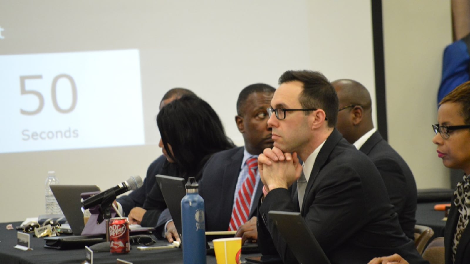 Shelby County Schools innovation chief Brad Leon listens to discussion during a recent school board meeting in Memphis.
