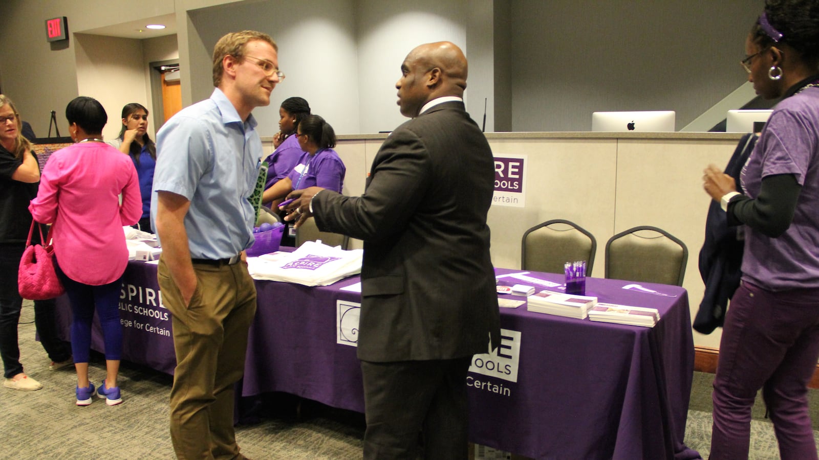 Nickalous Manning (right) represents Aspire Public Schools at a "Meet the Operators Fair" sponsored Oct. 8 in Memphis by Tennessee's Achievement School District.