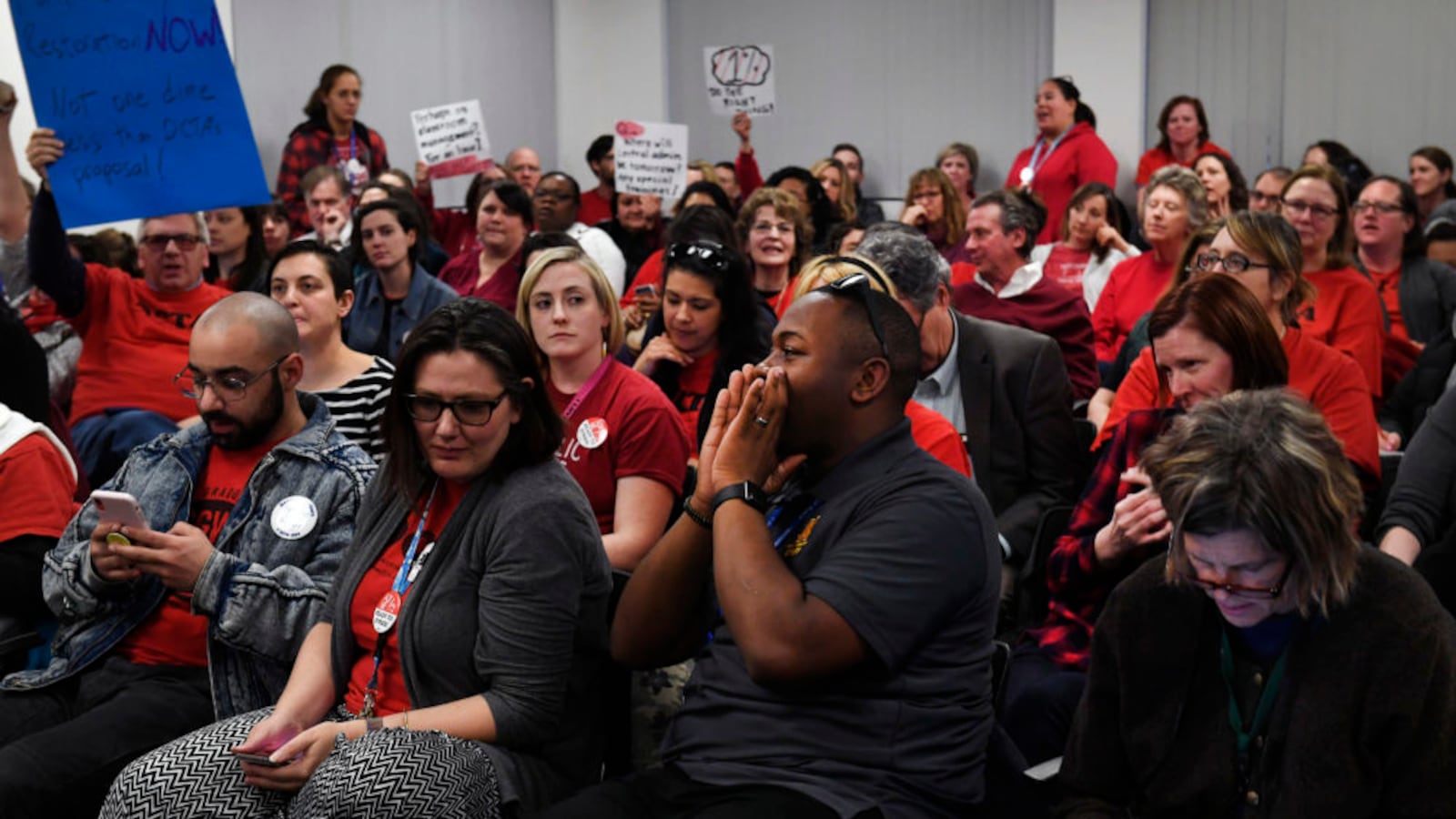 File photo shows Denver teachers packing a January bargaining session.