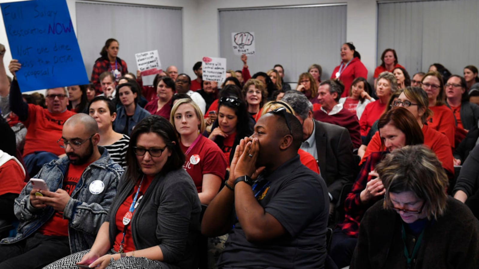 File photo shows Denver teachers packing a January bargaining session.