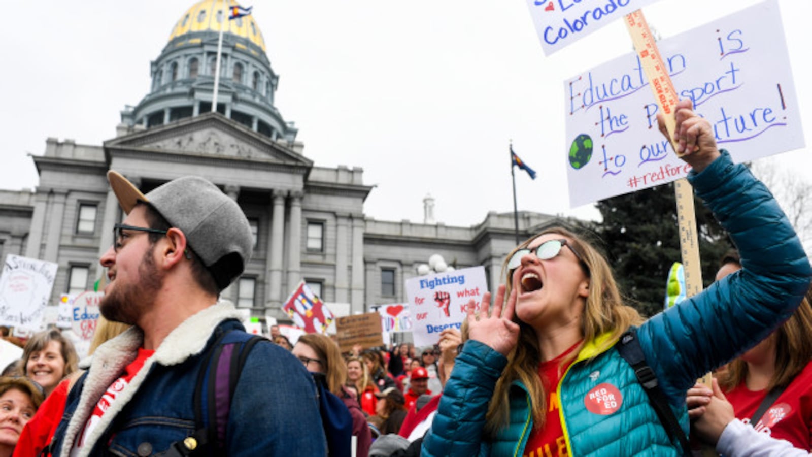 Teachers march during a rally for more educational funding at the Colorado State Capitol in April 2018.