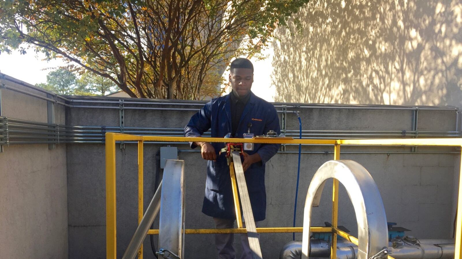 Kayvion Walton, 17, is learning how to test water samples as part of his environmental safety project. He is one of the students from Memphis Academy of Science and Engineering participating in the school’s pilot program with Smith & Nephew.