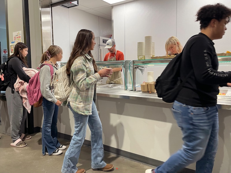 High school students in line at a cafeteria.