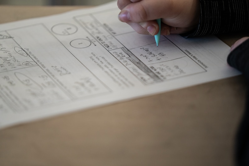 A student writes on an exam.