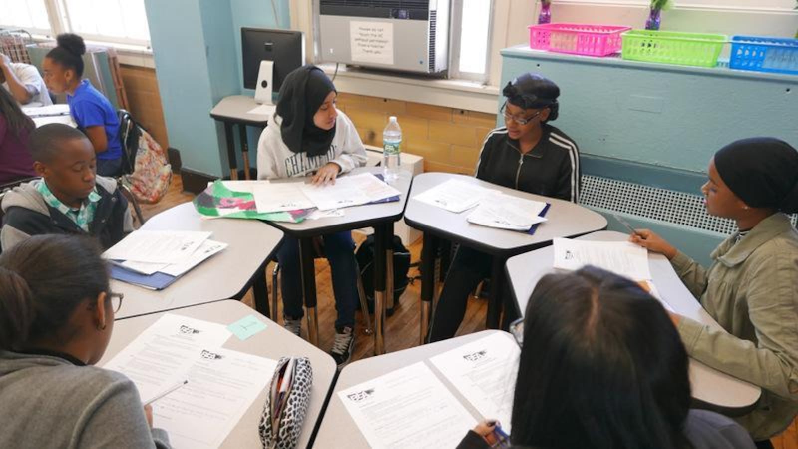 Students at Bronx Envision Academy participate in a portfolio roundtable in 2018.