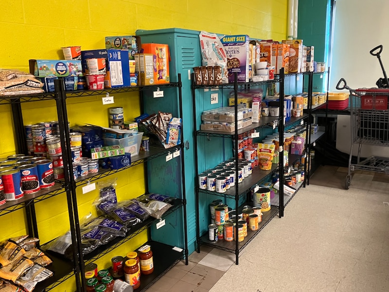A photograph of a food pantry in a school building.