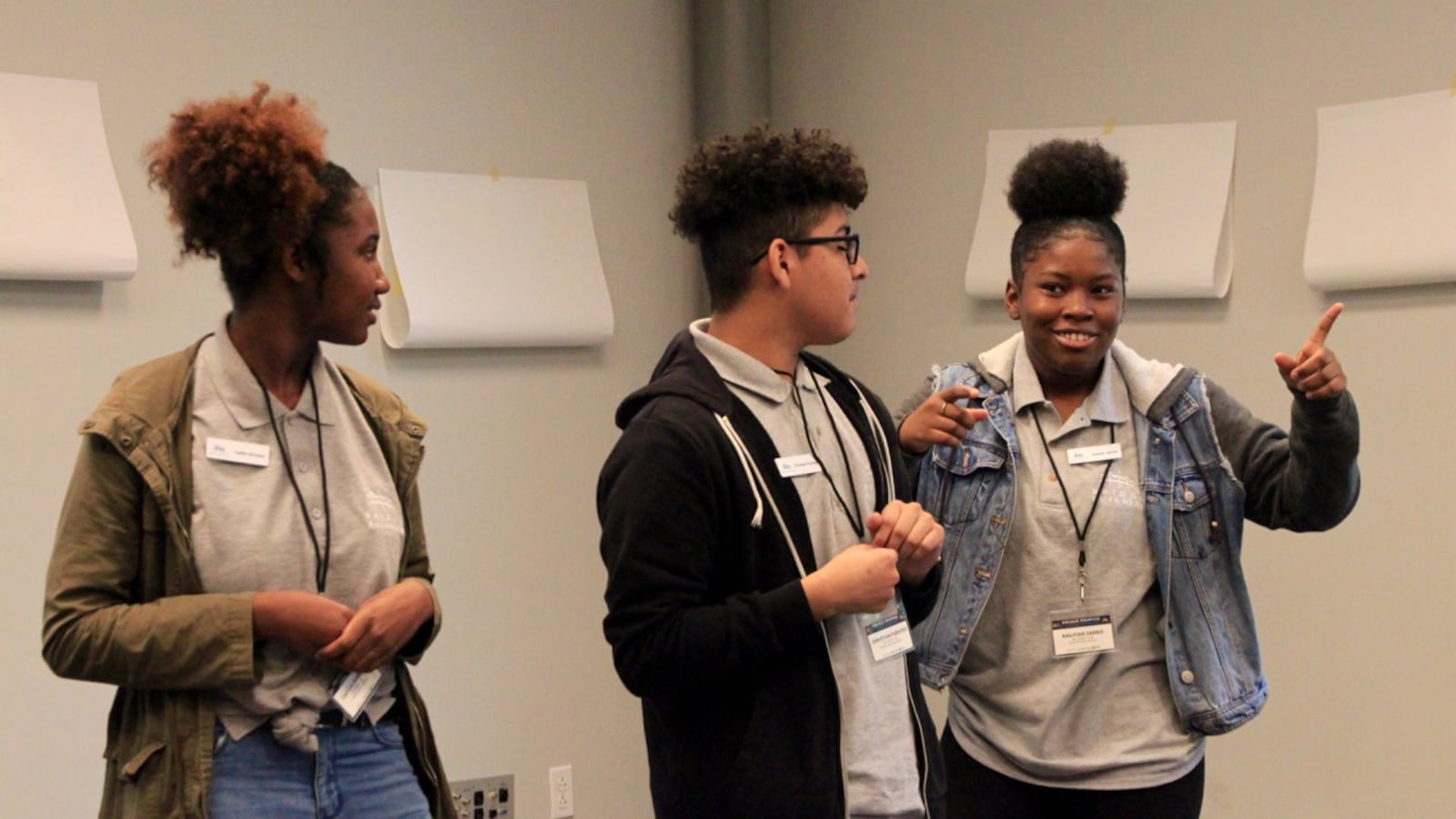 Caitlin Brinson (left), Christian Fuentes, and Aaliyah James lead a breakout session with fellow students on youth and education.