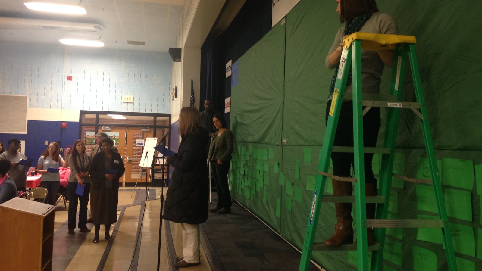 Neighbors shared their goals and vision for a community-led innovation school on a dream board at a meeting at School 15.