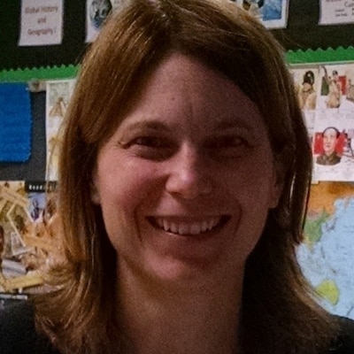 Headshot of a woman with shoulder-length light brown hair