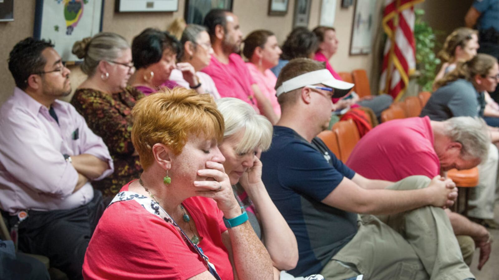 Members of the audience, mostly teachers and paraprofessionals, react to the 3-2 vote by the Pueblo school board to reject a recommendation for pay increases. (Chris McLean, The Pueblo Chieftain)