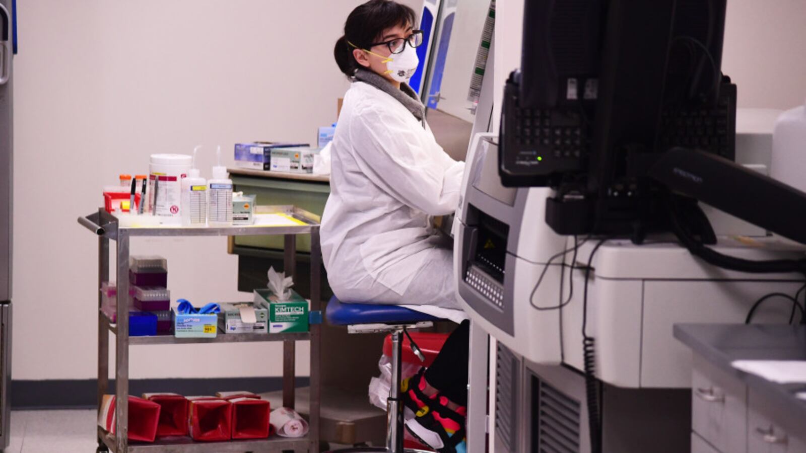 Ralen Johnson tests samples for COVID-19 at the Colorado Department of Public Health and Environment Laboratory Services Division in Denver, Colorado on March 14, 2020.