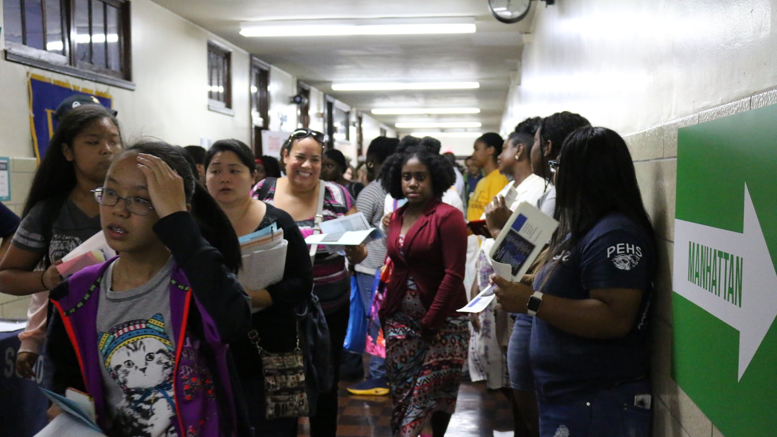 Tilden Campus high school students walk out of a PEP meeting, protesting plans to co-locate an elementary school.