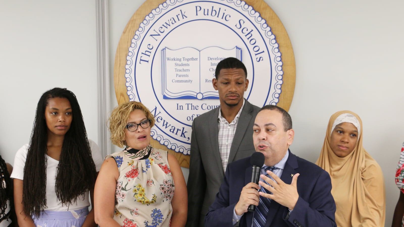 Shabazz High School's new principal, Naseed Gifted (third from left), with school board members and Superintendent Roger León.