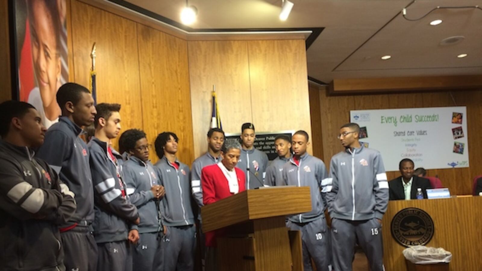 Denver Public Schools Board President Happy Haynes, center, in March recognized the East High School boy's basketball team for winning the state's championship tournament. Under Haynes' leadership Denver's school board has displayed few disagreements in public.