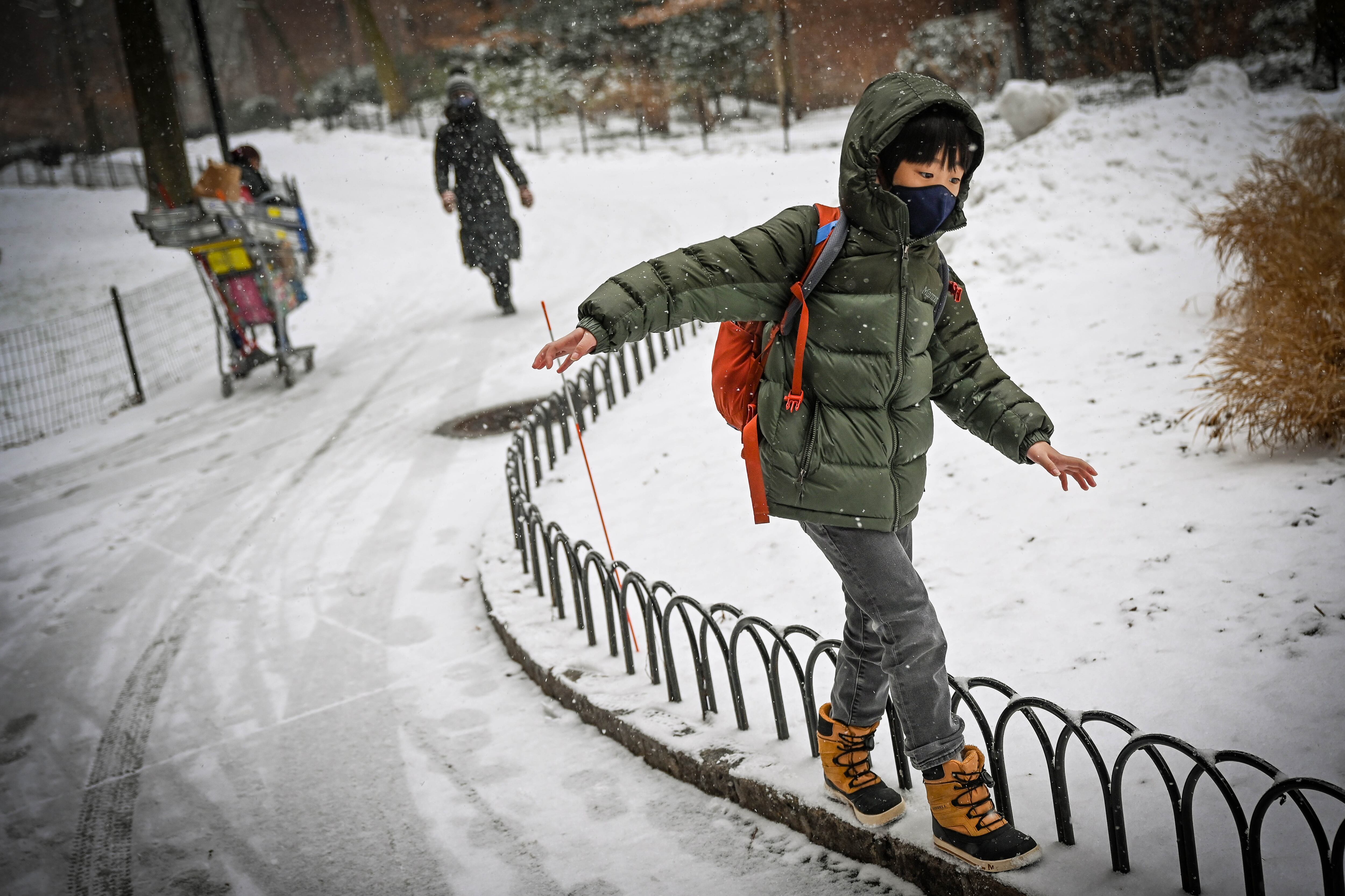 Nancy King’s son Drew walking in the snow.