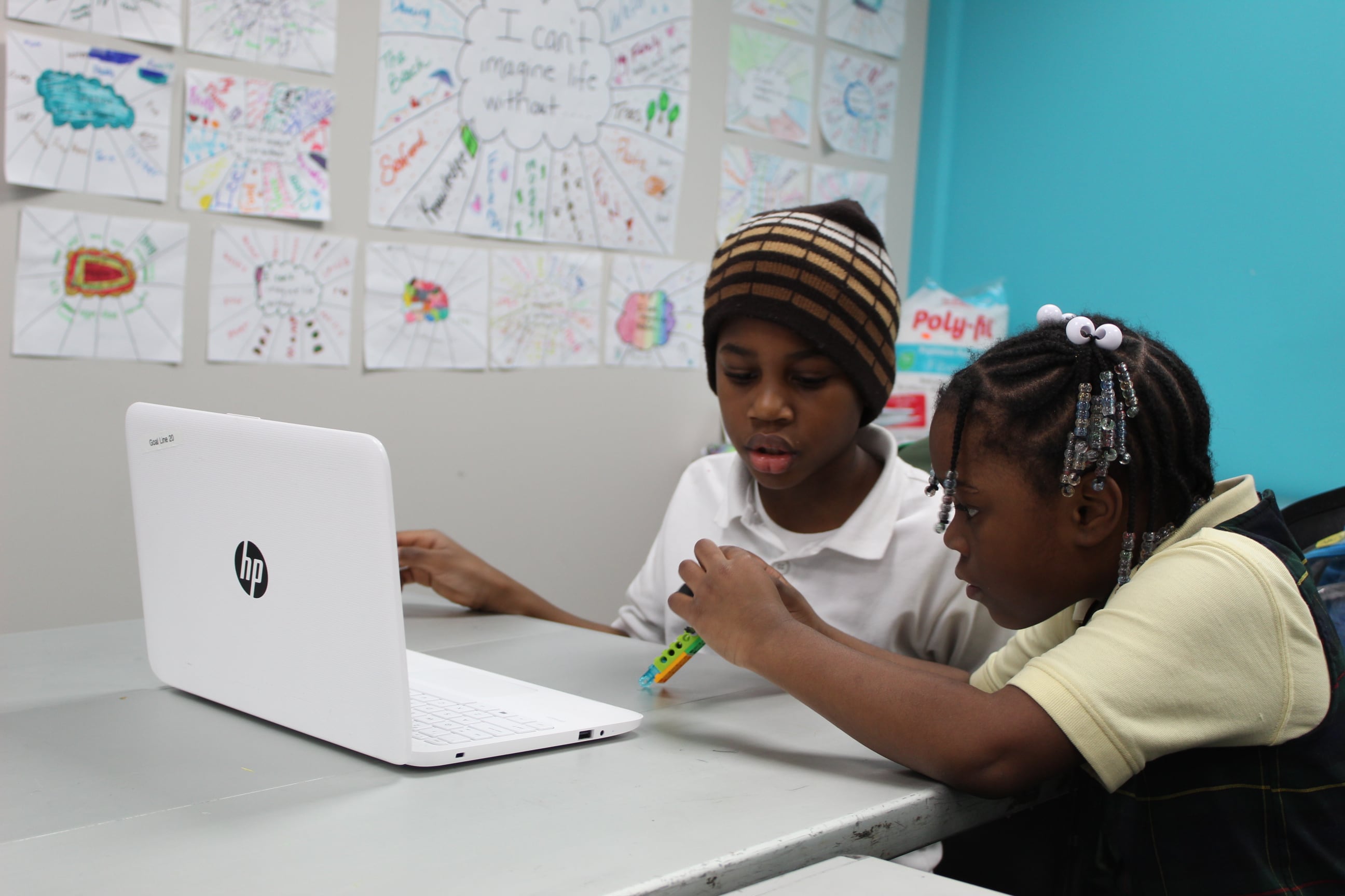 A free after school program offered by the GOAL Line includes lessons in robotics (seen here), swimming, and gymnastics.